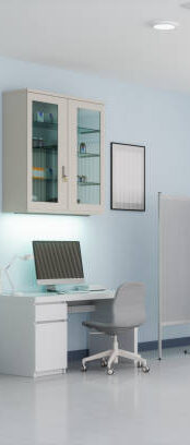 Modern medical exam room with built-in cabinetry and computer station – optimized for clinical workflow and hygiene