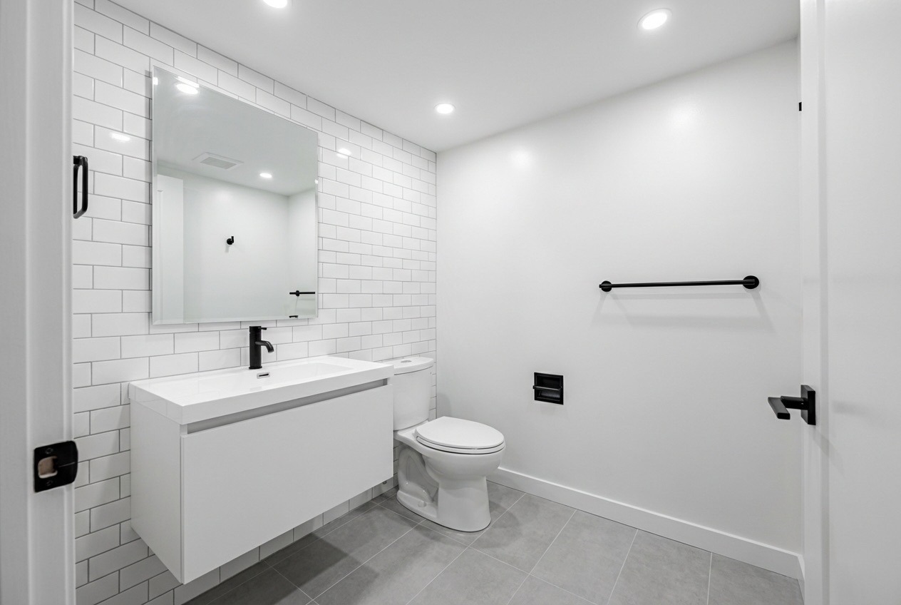 Clean retail store bathroom with modern fixtures